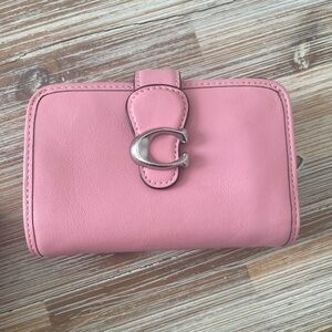 Coach Tabby medium wallet in vivid pink.